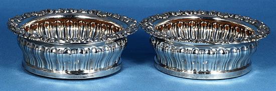 A pair of George IV silver wine coasters, Diameter 6 ¾”/170mm Height 60 Total weight inc bases 19.6ozs/557grs